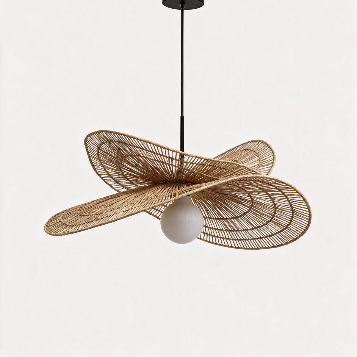 Isla Chandelier profile view, two layered rattan brims on a slim black rod