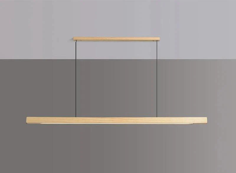 Juan pendant lamp hanging over a dining table