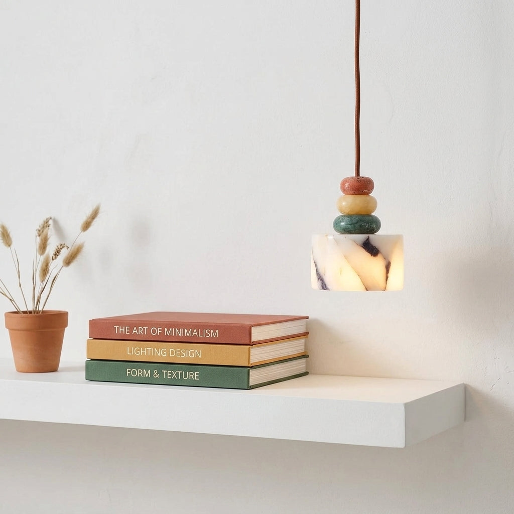 Cairn Pendant Lamp next to books on shelf
