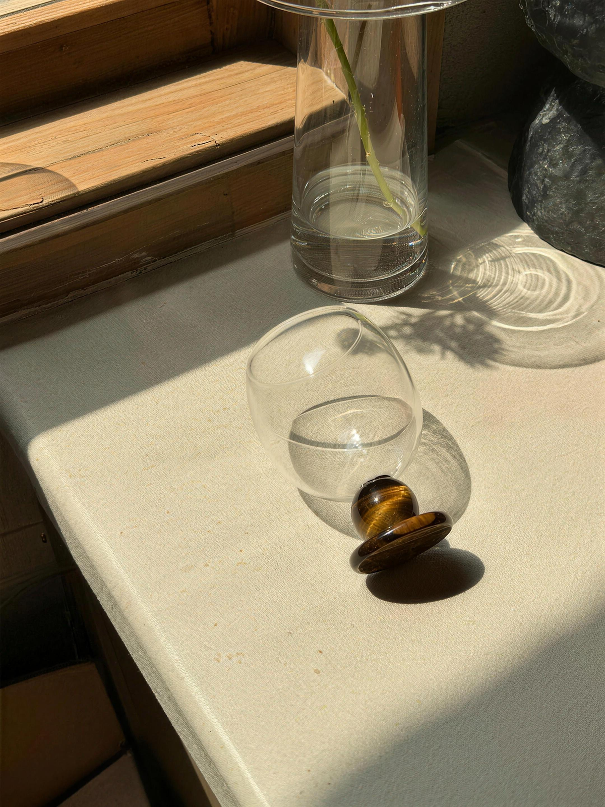Panarea goblet with amber stone resting in sunlight