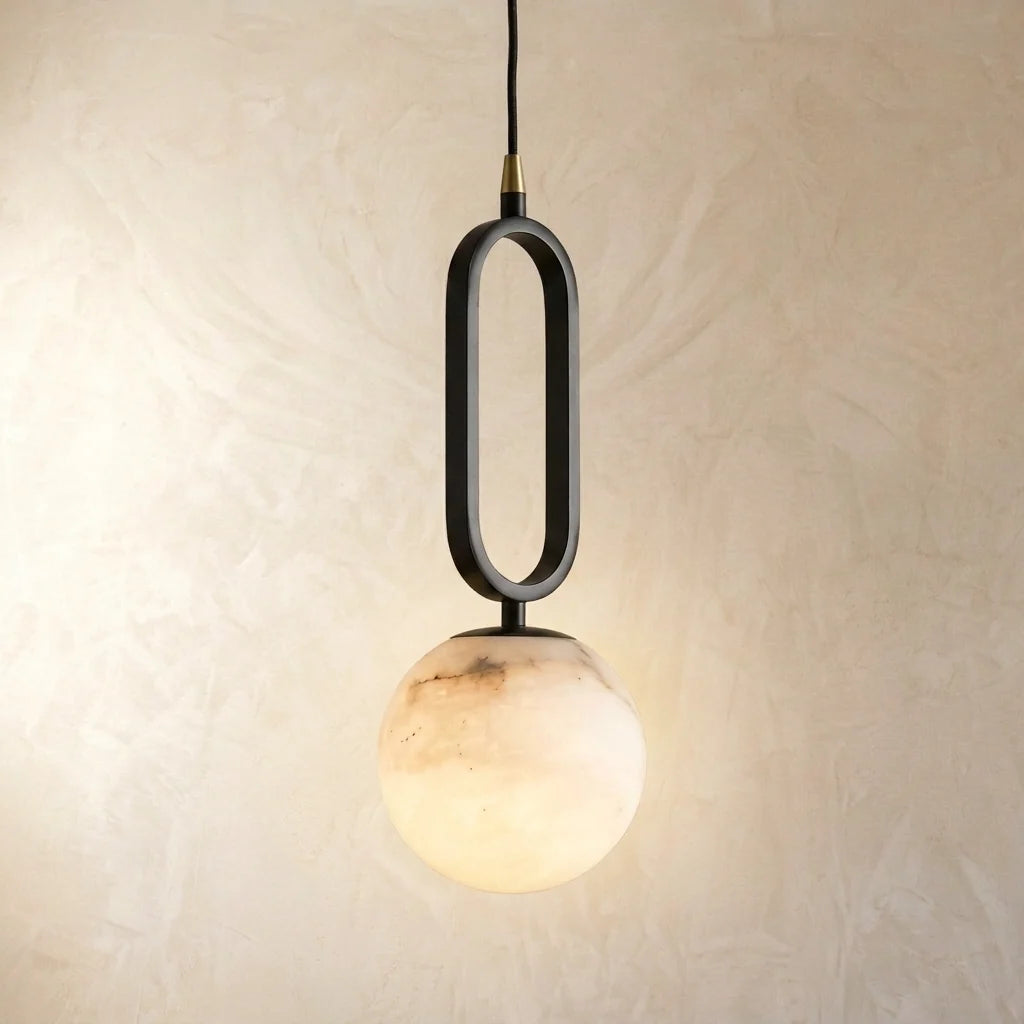 Gwen pendant light — natural marble globe shade, lit from within