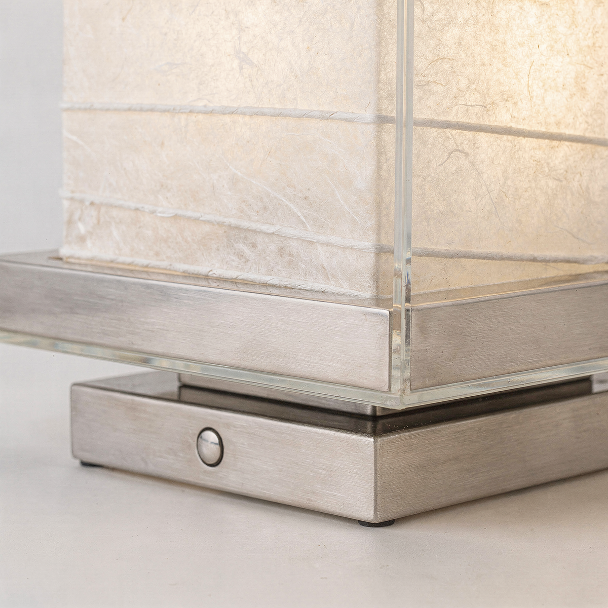 Kumo Table Lamp close-up of clear glass cover, steel base and touch dimmer