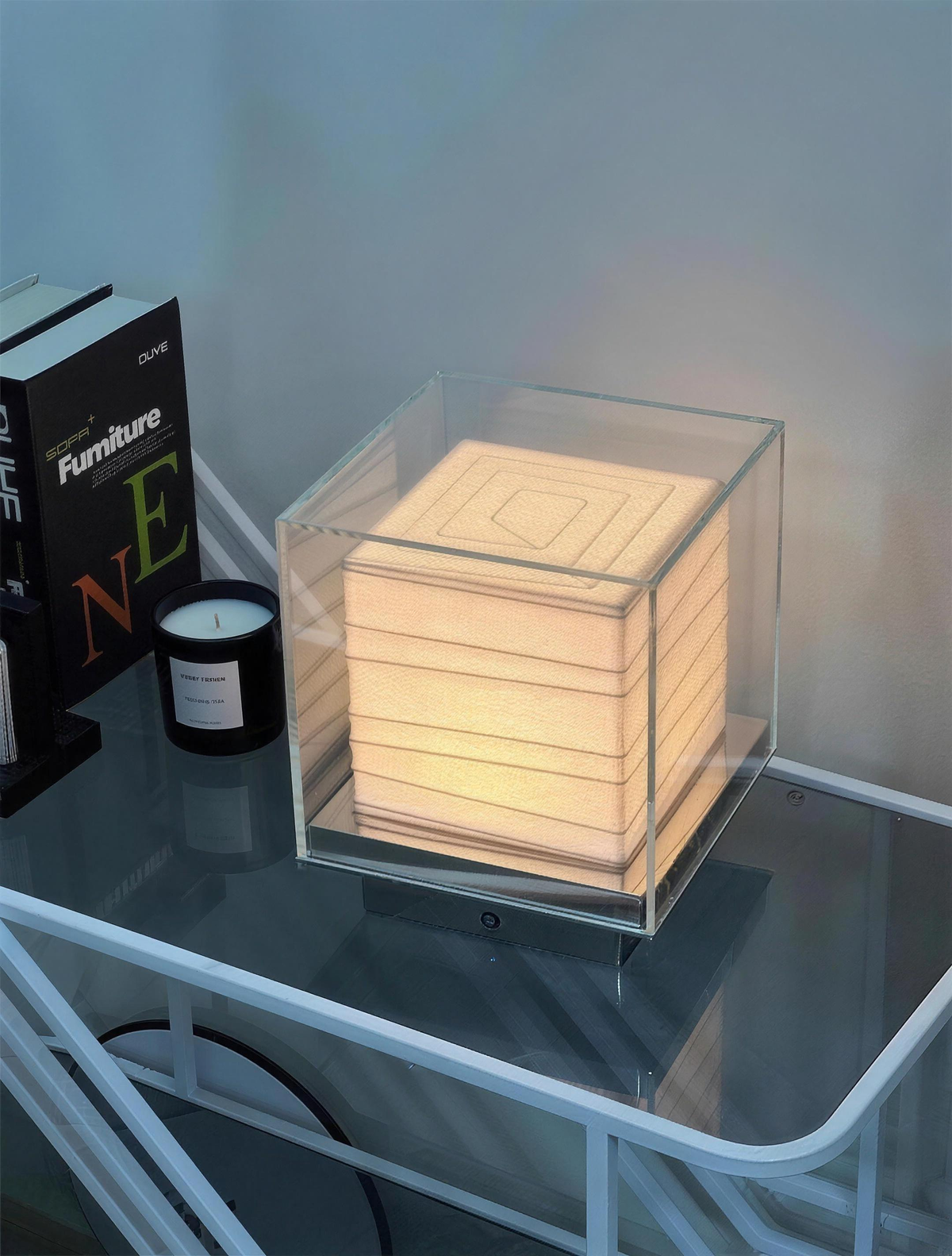 Kumo Table Lamp on a glass side table in soft evening light