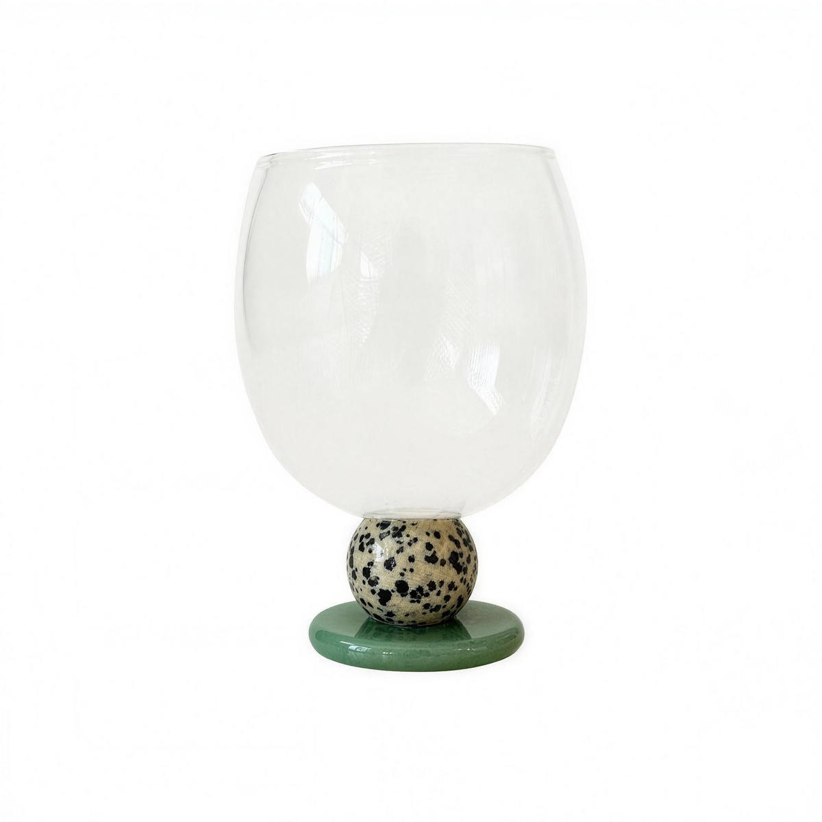 Panarea Glass Goblet, clear hand-blown bowl on a speckled stone ball, studio photo