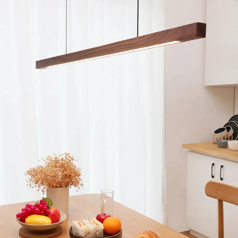 Juan wood pendant lamp shown in Pine finish